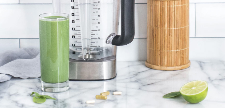 Smoothie and some medicines on a table