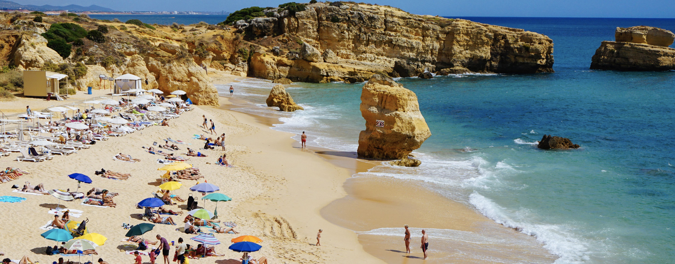 A lot of people sunbatheing on a beach