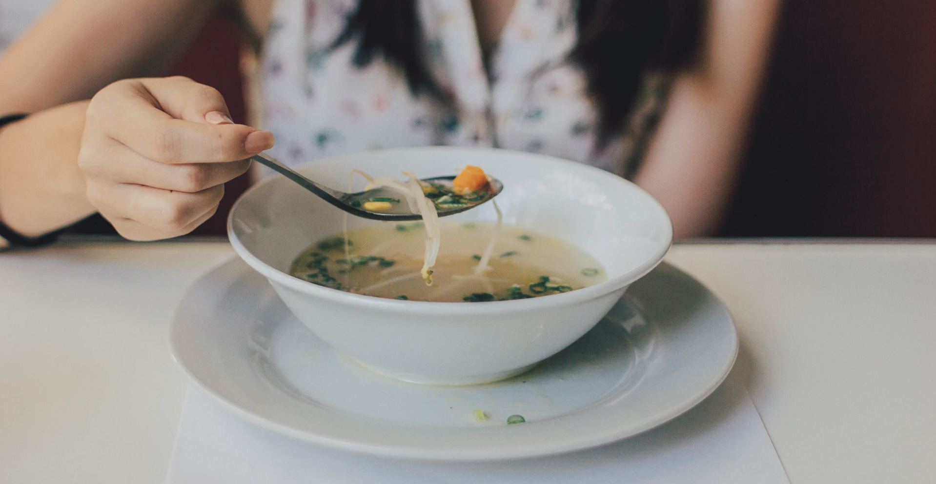 Girl eating soup