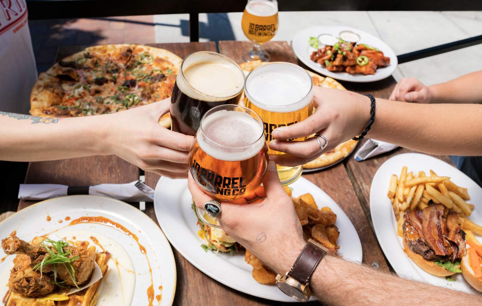 A group of friends having a dinner out and drinks