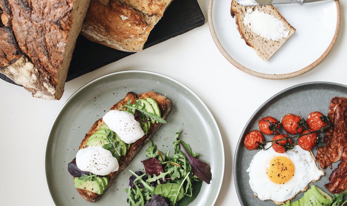 Breakfast options of eggs and bacon and sourdough bread