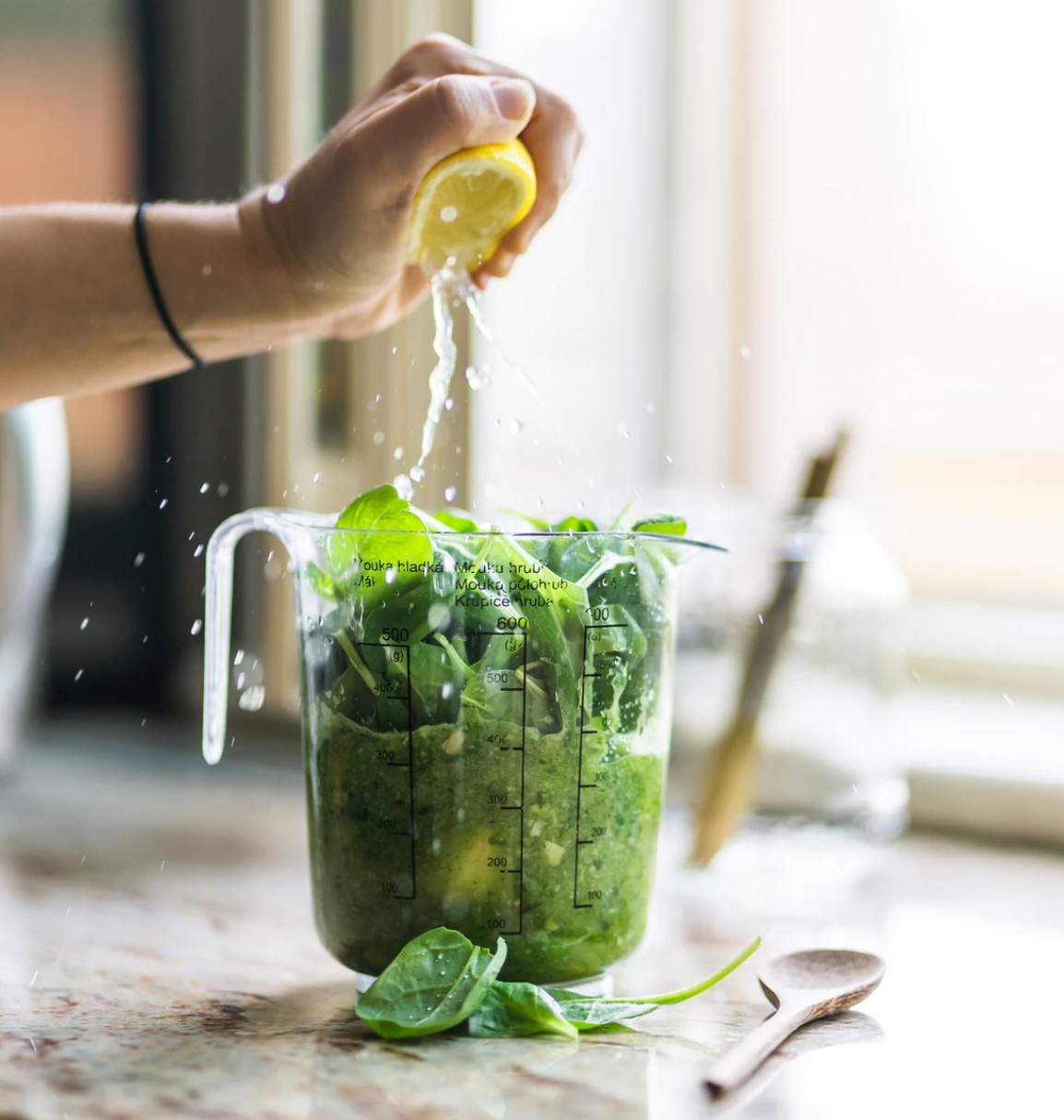 A big pitcher of greens and lemons for a smoothie