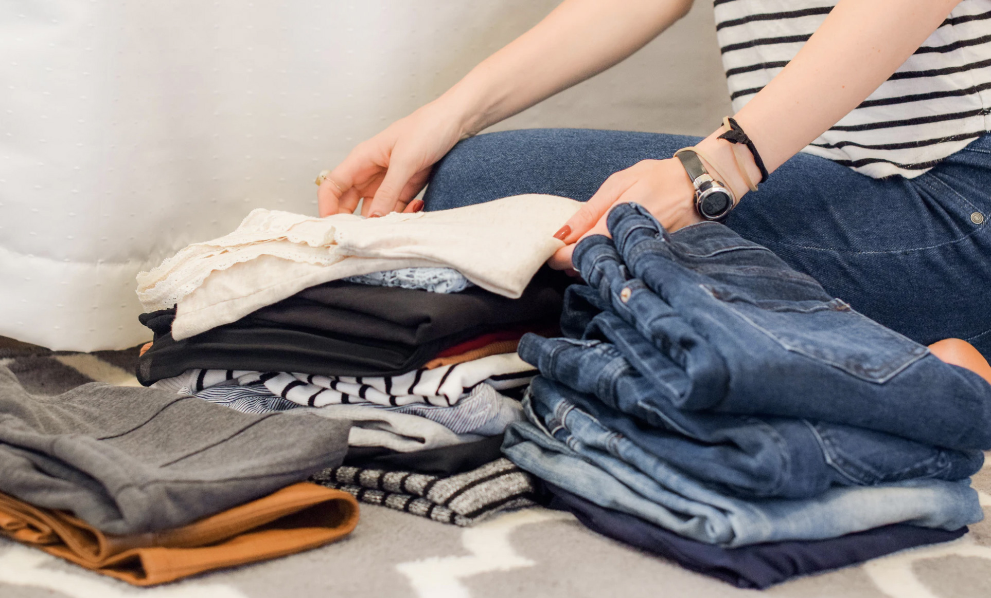 Woman folding clothing 