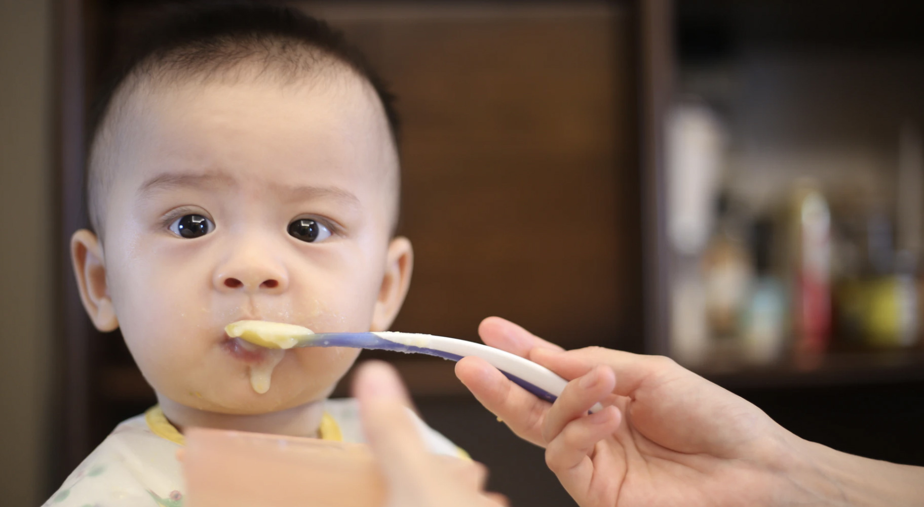 Mother feeding child 