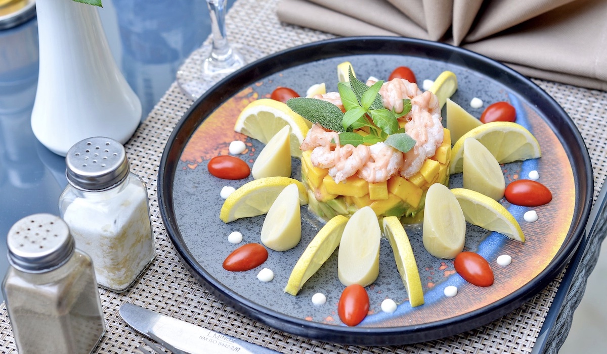 Well plated shrimp meal with fruits