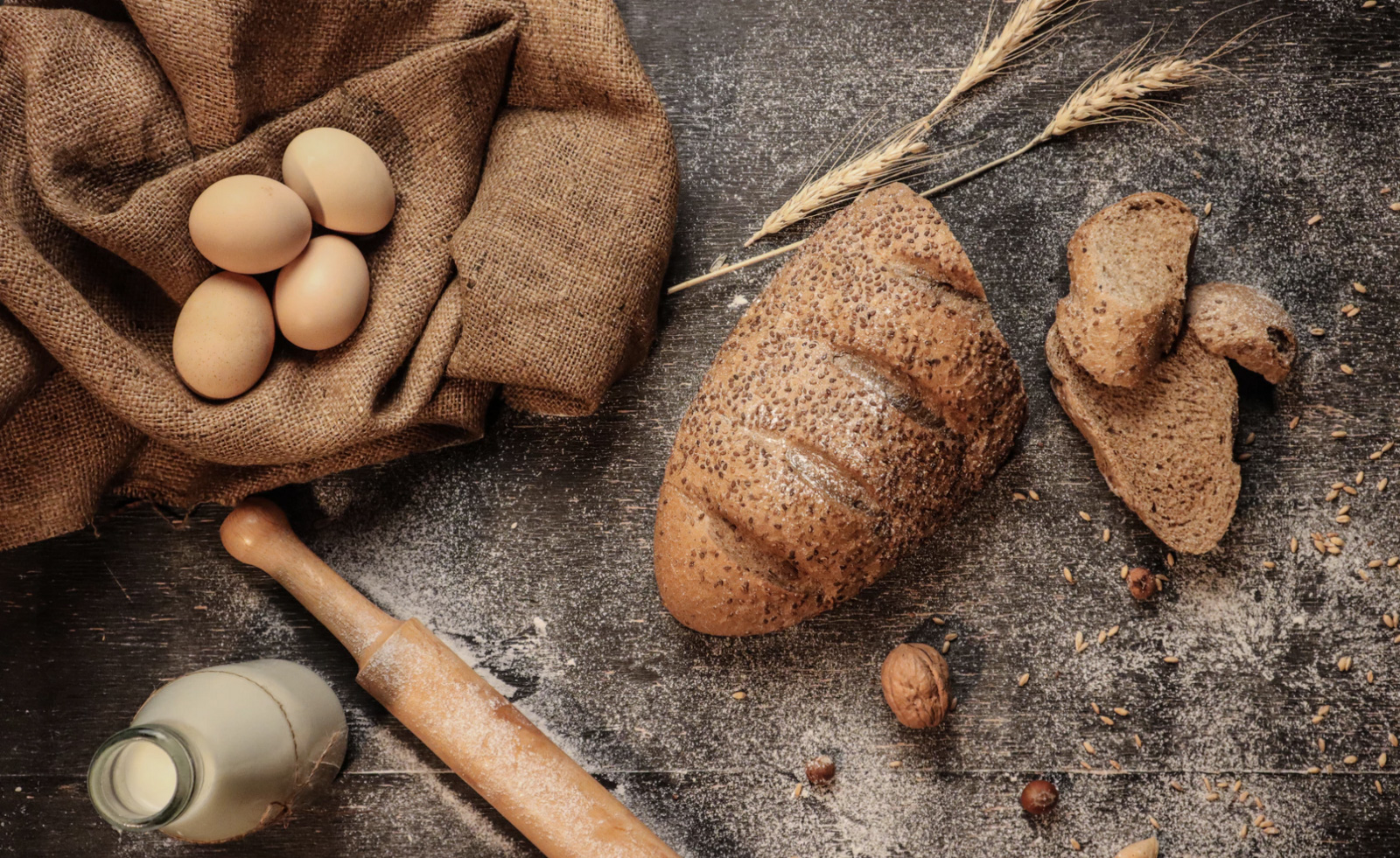 A table with bread eggs and milk, portraying food sensitivities