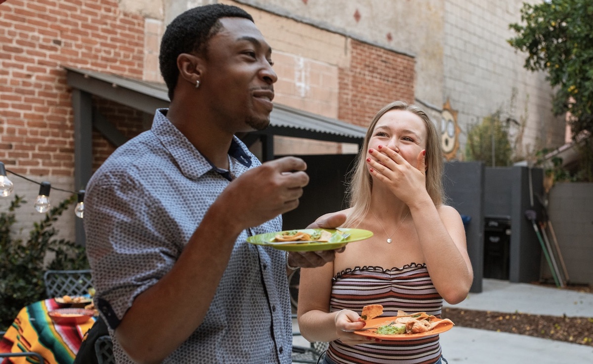 Two friends enjoying food together