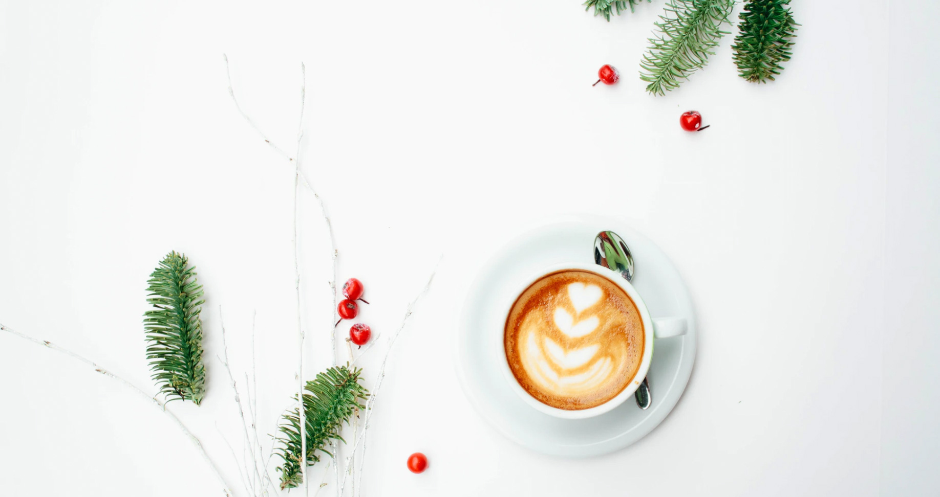 Cup of coffee and holiday decorations. unsplash - Toa Heftiba