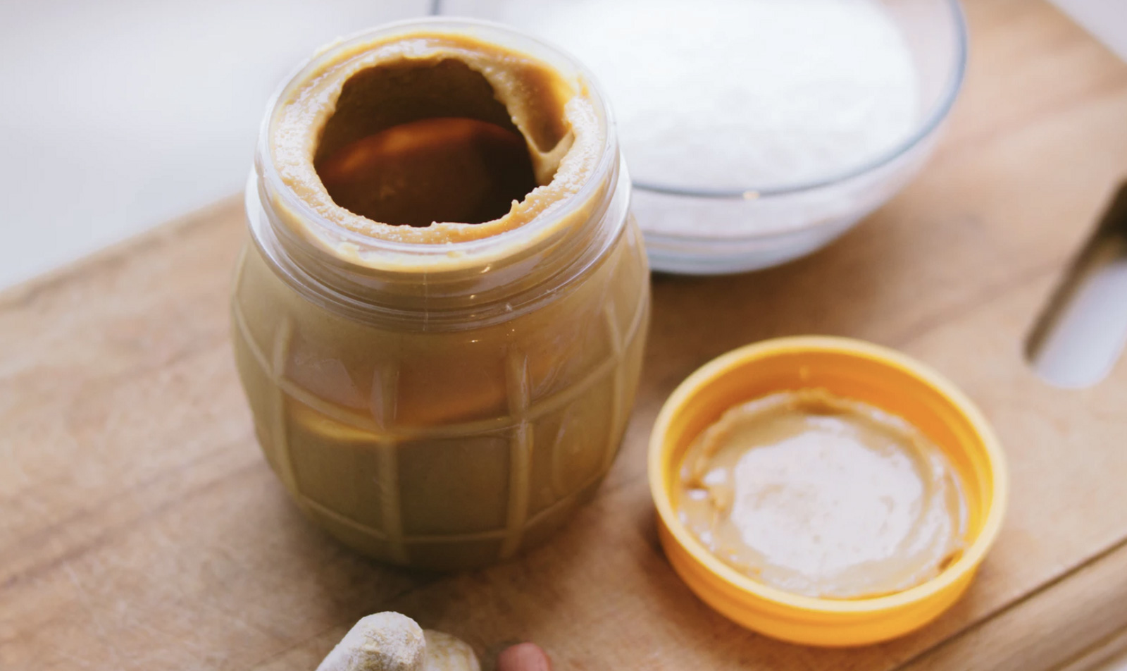 A jar of peanut butter that is open