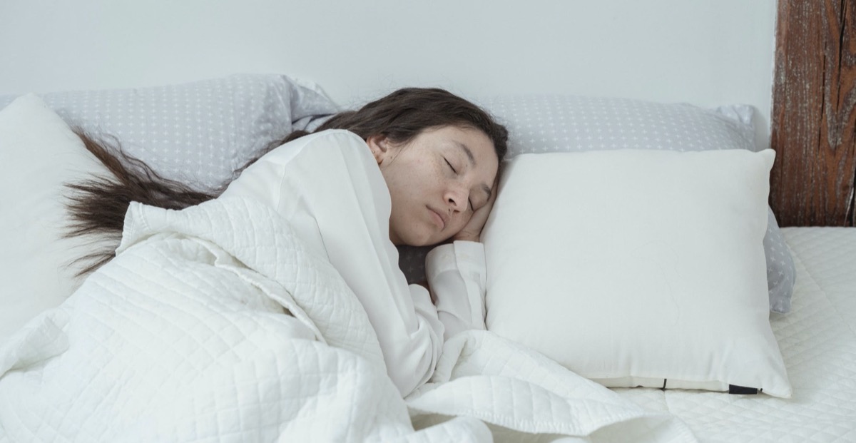 Woman sleeping in bed 